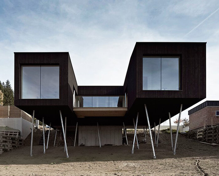 HPSA perches house S on stilts as lookout over austrian mountains