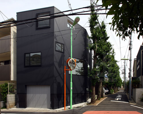 house at matsubara by atelier hako architects is lined with gingko trees 