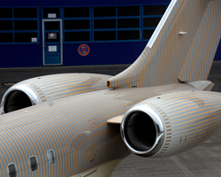 happy design studio wraps private jet in gradient stripe pattern