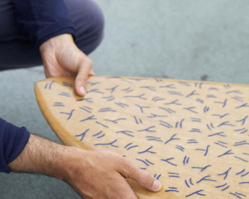 trust in design embroiders pattern into splash surfboard