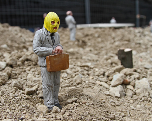 isaac cordal miniatures address the collapse of capitalism
