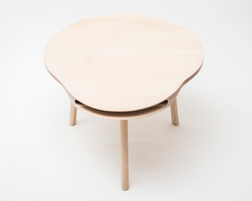 maple tokyo table by loic bard features a discreet storage compartment