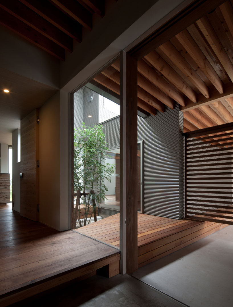 nakasai architects divides house in gankaiji with exterior landscape