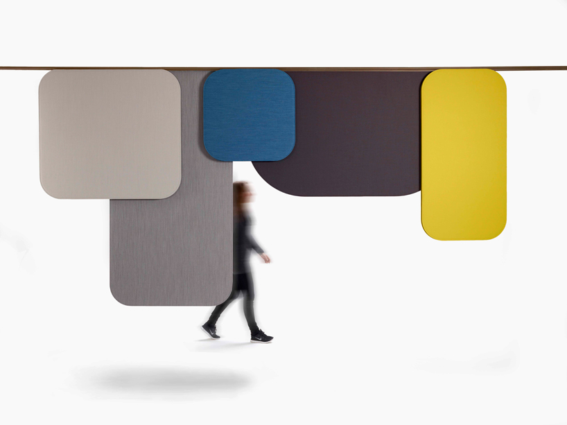 luca nichetto's sound panels for OFFECCT hang like clothing between buildings in italy