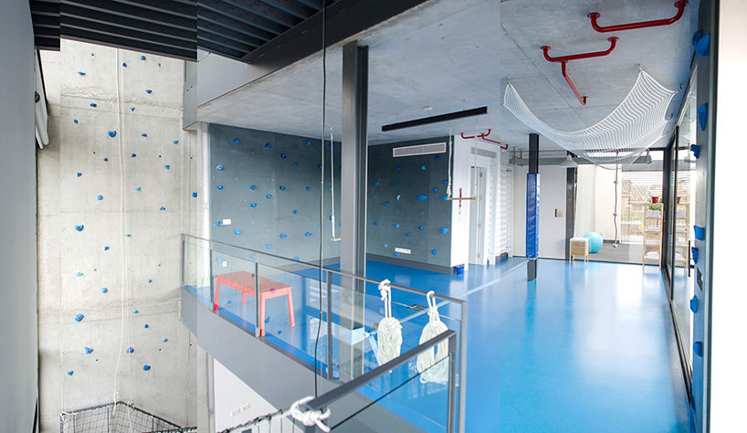 playoffice inserts children's indoor climbing gym into home