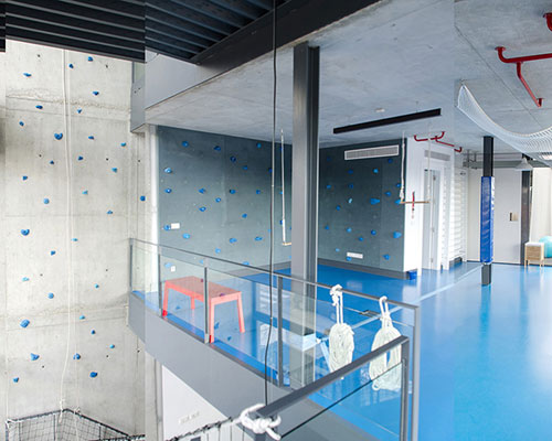 playoffice inserts children's indoor climbing gym into home