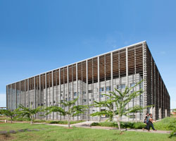 timber frame encloses university library by rh+ architecture