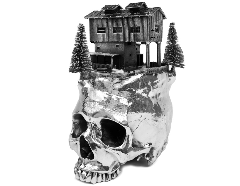 frodo mikkelsen situates landscapes on silver plated skulls