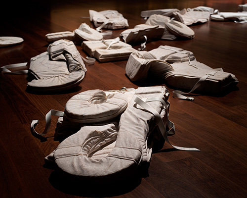 alex seton memorializes asylum seekers with 28 marble life jackets