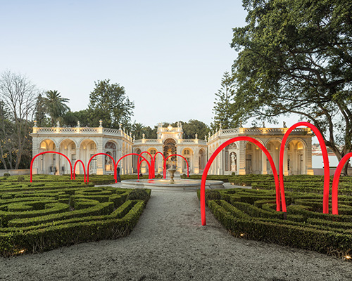 LIKEarchitects punctuates portuguese palace with illuminated red arches