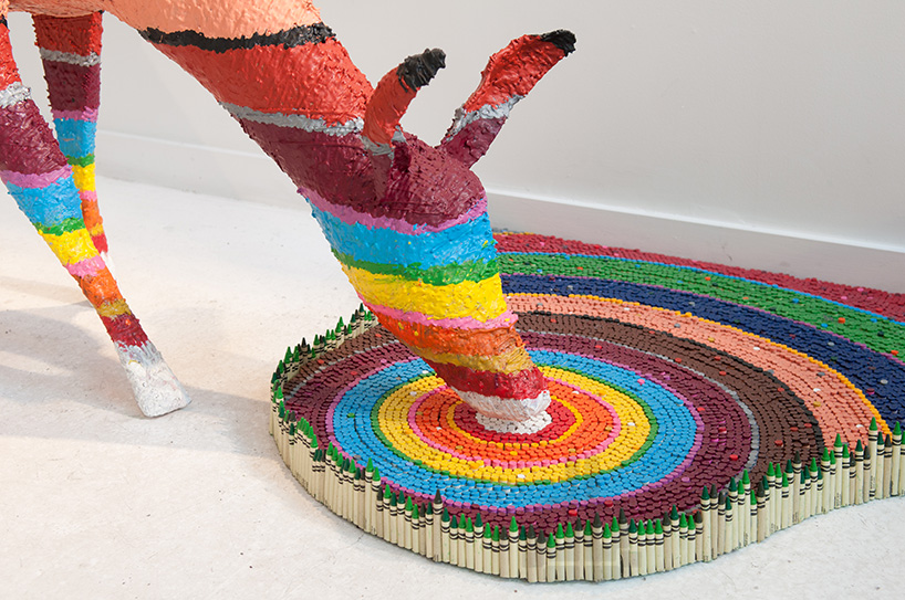 herb williams sculpts technicolor animals using thousands of crayons