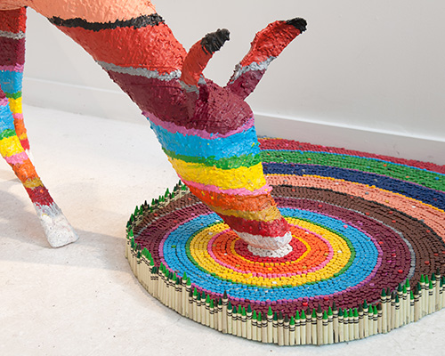 herb williams sculpts technicolor animals using thousands of crayons 