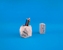 jinsik kim cuts stone age desk pieces from italian pink aurora