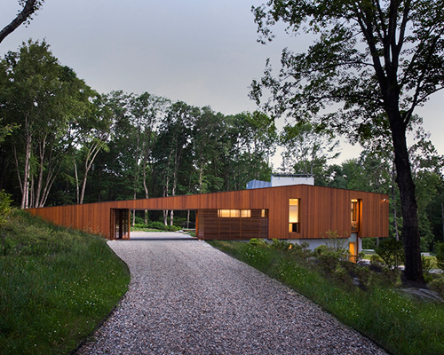 joeb moore + partners spans bridge house over landscape