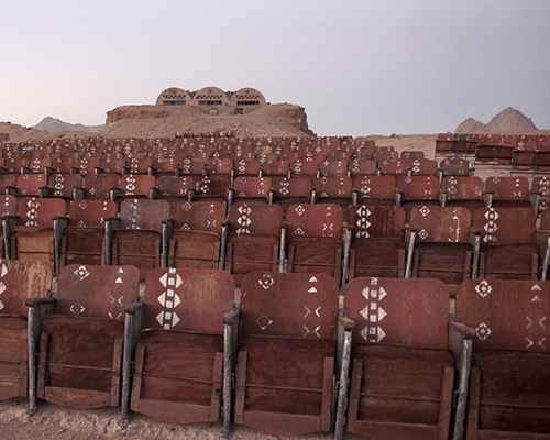 an abandoned movie theater lies in the middle of the egyptian desert