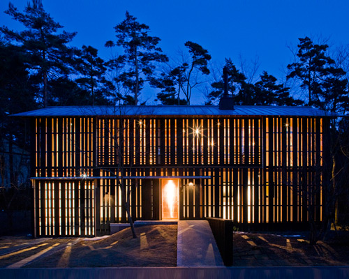 osumi yuzo clads house in daisen with retractable timber screen