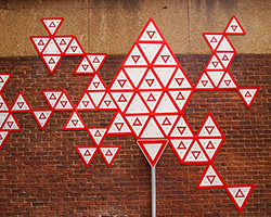 r1 arranges 100 yield signs in a johannesburg alleyway