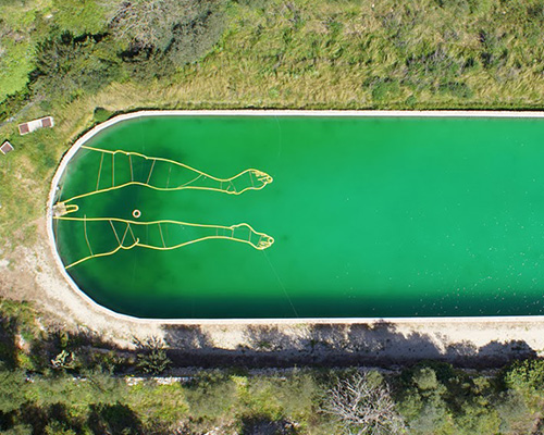santiago morilla draws bathing man using floating pool tubes