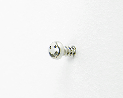 studio yumakano adds smiley face onto screws to bring joy