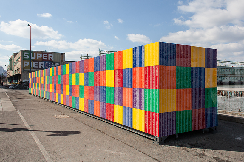 tony tasset carves 392,486 artists' names onto multicolored monument