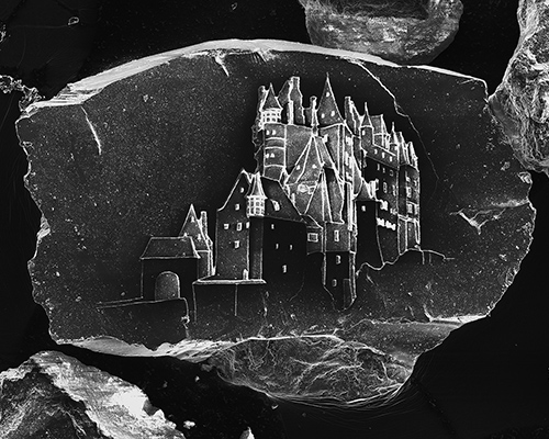 vik muniz + marcelo coelho etch microscopic castles on grains of sand