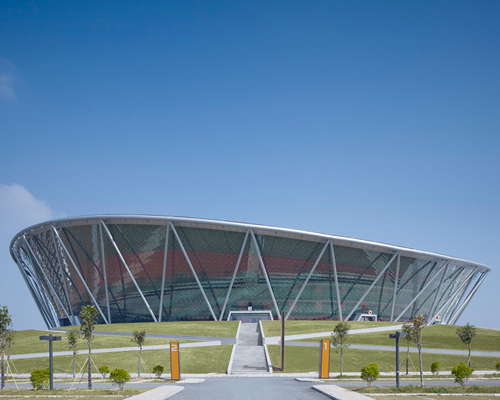 gerkan marg and partners completes net-like basketball stadium in china