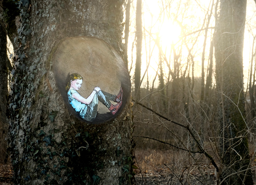 jana & js paint figures enclosed in tree trunk circles