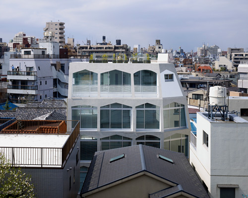 kentaro ataka completes tunnel-shaped apartment complex