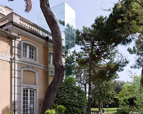 sp10 studio attaches mirrored elevator to italian villa