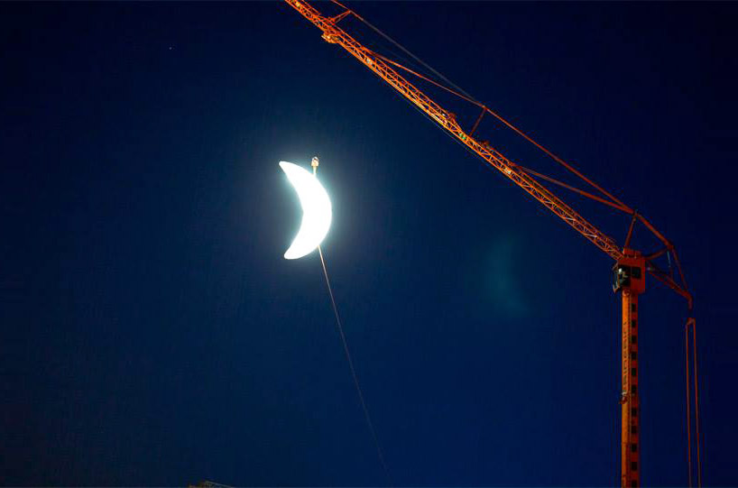 SpY sets a glowing crescent moon above the swiss landscape