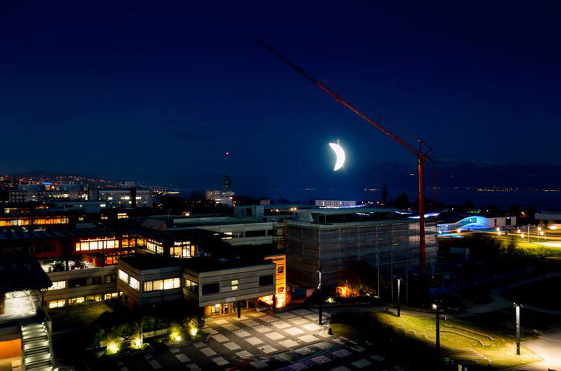 SpY sets a glowing crescent moon above the swiss landscape