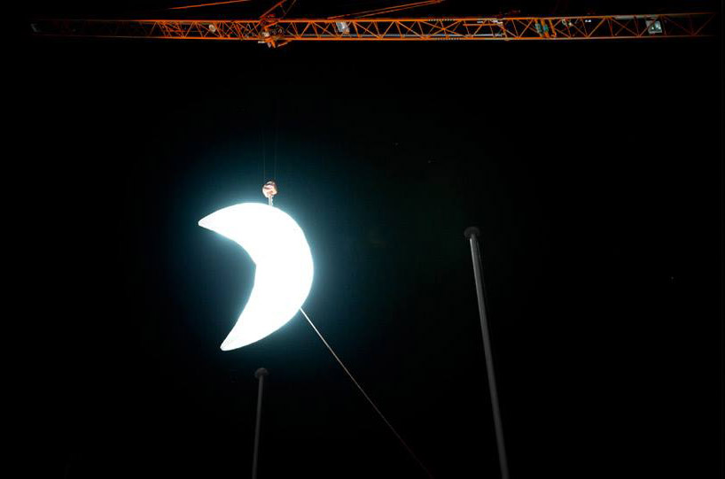 SpY sets a glowing crescent moon above the swiss landscape