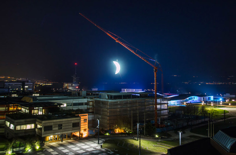 SpY sets glowing crescent moon above the swiss landscape