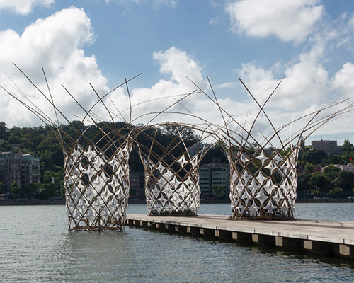 bloom pavilion interweaves bamboo rods on sai van lake in macau