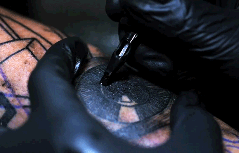guet administers ink in mesmerizing slow motion tattoo footage