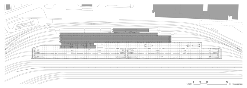 EM2N clad railway service facility with billowing cement facade