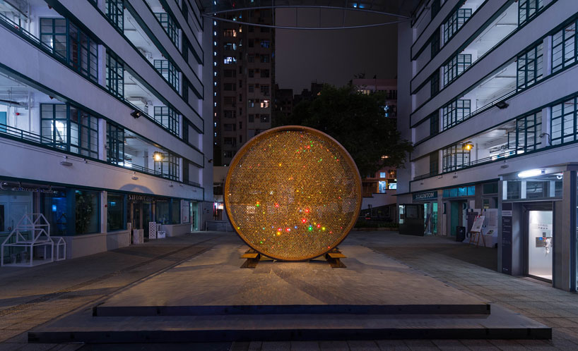 fredrikson stallard suspends 8,000 golden swarovski crystals in a luminous ring