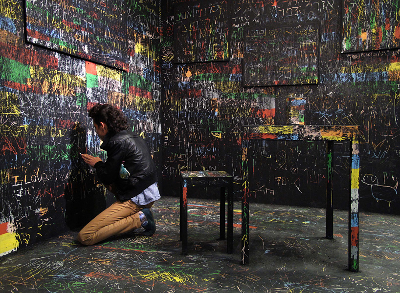 itay ohaly etches onto black walls to reveal colored memories