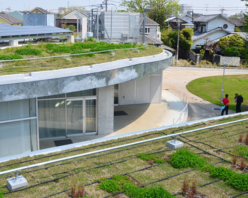jun aoki sinks omiyamae gymnasium into landscape in tokyo