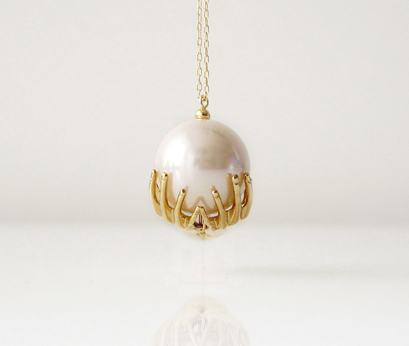 pearl necklaces symbolically reflect the world as your oyster