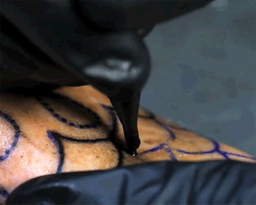 guet administers ink in mesmerizing slow motion tattoo footage