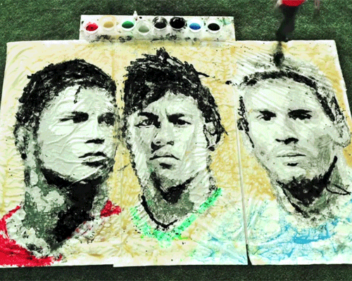 red hong yi paints ronaldo, neymar + messi using a football