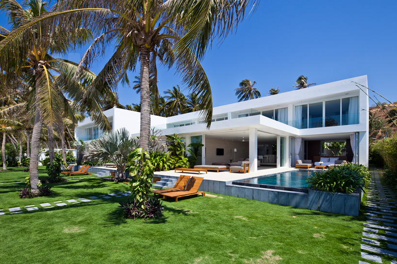 oceanique villas by MM++ architects open onto beach in vietnam