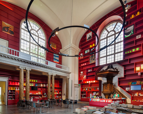 red shelves transform entrance to stedelijk museum schiedam by MVRDV