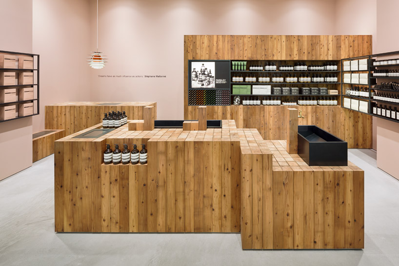 torafu architects warm aesop grand front osaka with japanese cedar