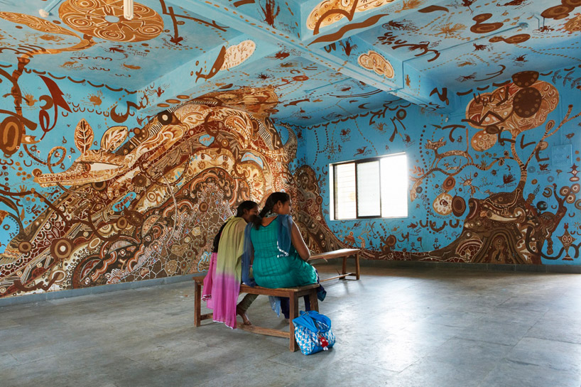 yusuke asai covers classroom in maharashtra with a painted mud mural