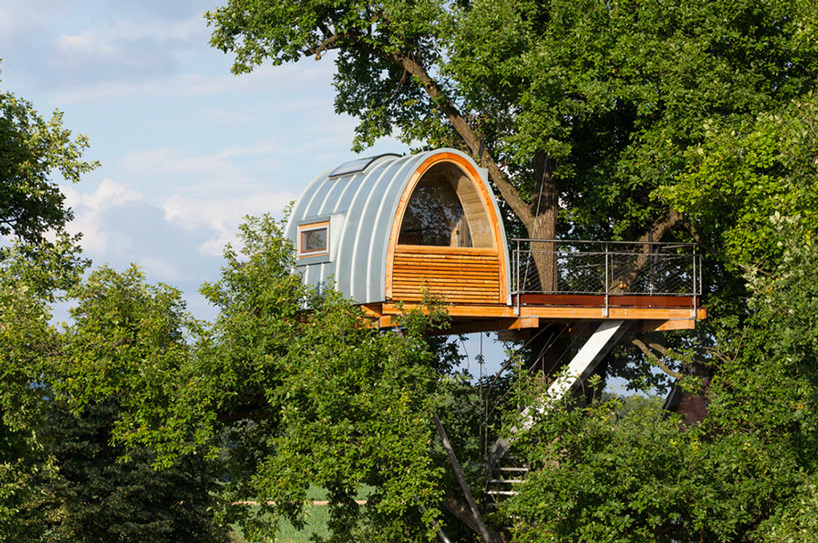 curving stair accesses treehouse halle by baumraum in germany