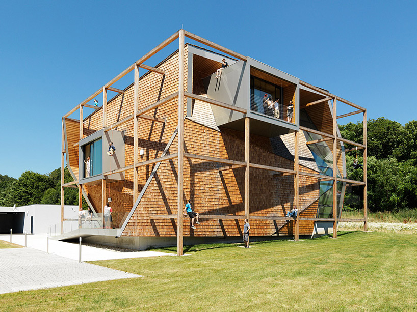 heri&salli inscribes angular volume inside timber frame for office off