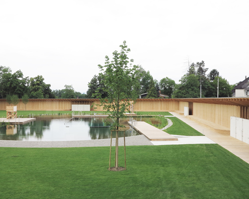 herzog & de meuron creates natural bathing pond for naturbad riehen