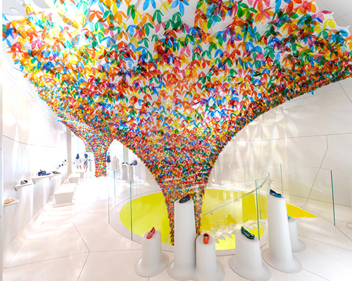 SOFTlab colorizes shoe gallery in new york with flower canopy